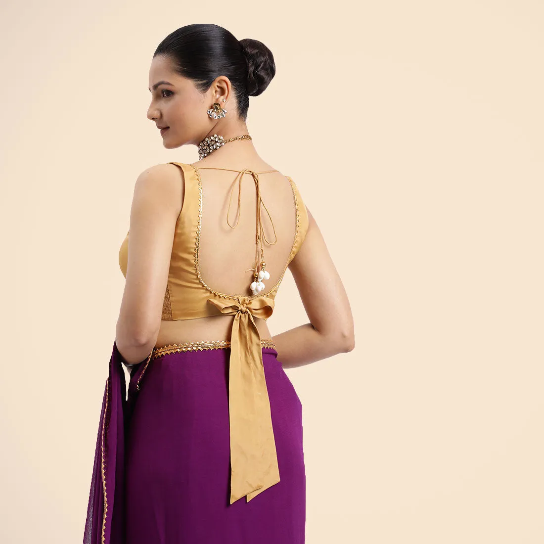 Raisa x Tyohaar | Gold Sleeveless FlexiFit™ Saree Blouse with V Neckline with Golden Gota Lace Embellishment and Back Cut-out with Tie-Up